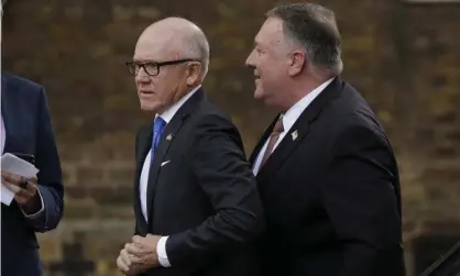  ??  ?? Woody Johnson, left, and Mike Pompeo walk to 10 Downing Street in London on Tuesday. Photograph: Matt Dunham/AP