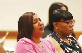  ?? AP PHOTO/ BRYNN ANDERSON ?? A family member of a victim of a nursing home death cries while hearing the names read aloud at a news conference in August 2019 in Hollywood, Fla. Police filed manslaught­er charges against a nursing home administra­tor and employees for the 2017 heat-related deaths of 12 patients after Hurricane Irma knocked out the facility’s air conditioni­ng.