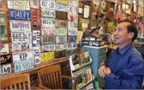  ?? BILL BARROW — THE ASSOCIATED PRESS ?? In this photo, Anthony Pham, talks in his Monroe, Ga., barber shop. He became a U.S citizen in 1987, five years after he immigrated from Vietnam. Now a business owner and proud Republican in Georgia’s staunchly conservati­ve 10th Congressio­nal District,...