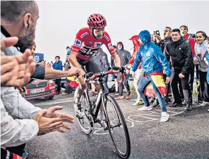  ??  ?? Hard going: Chris Froome struggles up to Los Machucos on Wednesday and will find today even tougher