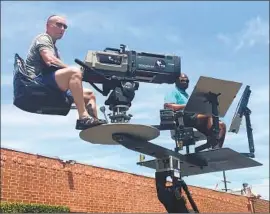  ?? Ruthanne Rothman ?? PRODUCER JAY ROTHMAN, left, came up with the idea of putting McFarland on a cart above the line but treating him as an extension of the broadcast booth.