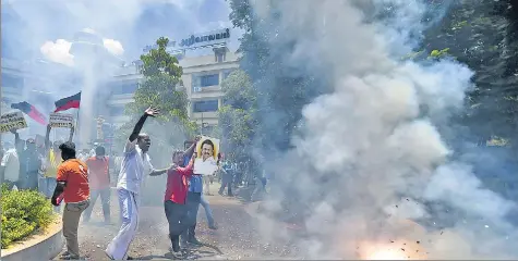  ??  ?? DMK workers celebrate during the counting of votes in Chennai on Sunday.