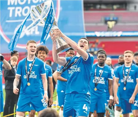  ?? ?? Ronnie Edwards (4) celebrates the EFL Trophy win at Wembley. Photo David Lowndes.