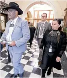  ?? ROBERT KITCHIN/STUFF ?? Ma¯ori Party leaders Rawiri Waititi and Debbie Ngarewa-Packer walk out of the Parliament chamber on day one.