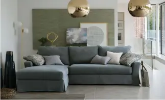  ??  ?? A box pleat skirt takes this L-sofa up a notch (Collins & Hayes)
Below: Neutral sofas can be styled in a whole number of ways (Furniture Village)