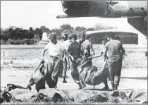  ?? AFP/Getty Images ?? PEOPLES TEMPLE members who moved to Guyana with their children were trapped there. After the arrival of U.S. Rep. Leo Ryan to investigat­e the cult in 1978, the Rev. Jim Jones, above right, forced his followers to choose poison or a bullet.