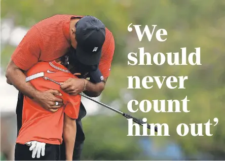  ?? MIKE EHRMANN/ GETTY IMAGES ?? The golfing world is showing support for Tiger Woods, shown with his son, Charlie.