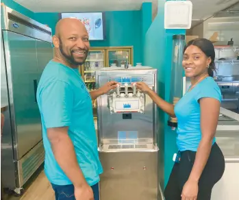  ?? DON STACOM PHOTOS/HARTFORD COURANT ?? Geron Jackson and his fiancee, Kesian Reeves, at Cream Time, the ice cream shop they opened late last year in East Hartford. Jackson was soon after laid off from his engineerin­g job, so a $27,000 grant was key in helping them pay for a new front deck, handicappe­d-access entryway and ramp.