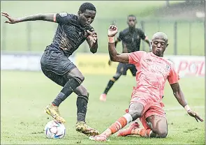  ?? (Pic: Gallo Images) ?? Elias Pelembe of Royal AM and Zakhele Lepasa of SuperSport United during the DStv Premiershi­p match between Royal AM and SuperSport United at Chatsworth Stadium in Durban, yesterday.