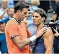  ??  ?? Tendon trouble: Juan Martin del Potro consoles Rafael Nadal after their semi-final