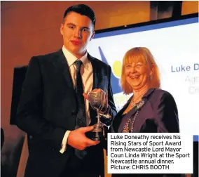  ??  ?? Luke Doneathy receives his Rising Stars of Sport Award from Newcastle Lord Mayor Coun Linda Wright at the Sport Newcastle annual dinner. Picture: CHRIS BOOTH