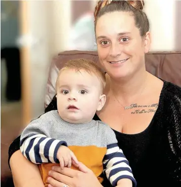  ??  ?? > Rachel Collins and her son Freddie, who contracted viral meningitis