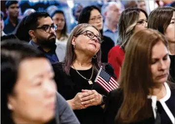  ?? BEN GRAY FOR THE ATLANTA JOURNAL-CONSTITUTI­ON ?? Dina Pimentel, from Argentina, can’t hold back her emotions after she was sworn in as a naturalize­d citizen during a ceremony at the Carter Center in Atlanta on Sunday. The ceremony was held at the center in honor of President Jimmy Carter’s 99th birthday.