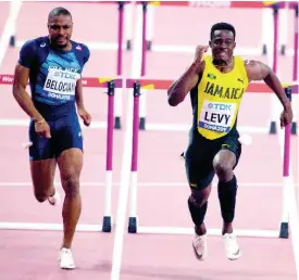  ??  ?? Ronald Levy wins his heat ahead of Wilhem Belocian of France in the preliminar­y round of the men’s 110m hurdles at the 2019 IAAF World Championsh­ips in Doha, Qatar, on September 30.