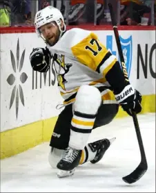  ?? ?? Bryan Rust celebrates his tying goal late in the third period Saturday night against the Hurricanes.