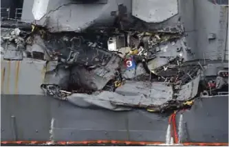  ??  ?? YOKOSUKA: Damage to the guided missile destroyer USS Fitzgerald is seen as the vessel is berthed at its mother port in Yokosuka, southwest of Tokyo. — AFP