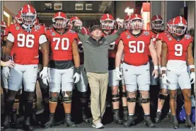  ?? USA Today Sports - Brett Davis ?? Georgia coach Kirby Smart and his team wait to run onto the field before last Saturday’s Peach Bowl against Ohio State at Mercedes-Benz Stadium.