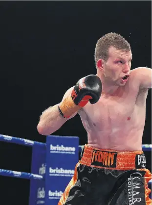  ??  ?? Fistic finesse . . . Australian WBO champion Jeff Horn connects with a straight left to the head of Irish challenger Gary Corcoran during their welterweig­ht world title fight in Brisbane yesterday. Horn won by a late stoppage.