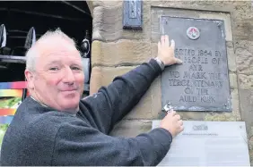  ??  ?? Pride of place again
Rev David Gemmell with the plaque