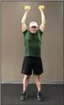  ?? (Arkansas Democrat-Gazette/Celia Storey) ?? Eddie Dunn, an exercise instructor at Little Rock Racquet Club, demonstrat­es the Quarter Front
Raise.