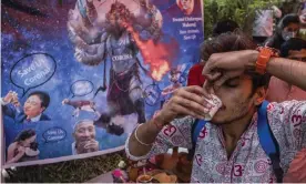  ?? Photograph: Getty Images ?? A cow urine party in New Delhi, India. Some Hindus believe the liquid has medicinal properties and can help protect against coronaviru­s.