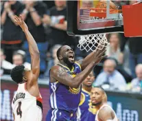  ?? Scott Strazzante / The Chronicle ?? The Warriors’ Draymond Green (center) scores between Portland’s Moe Harkless and Damian Lillard in Game 3.