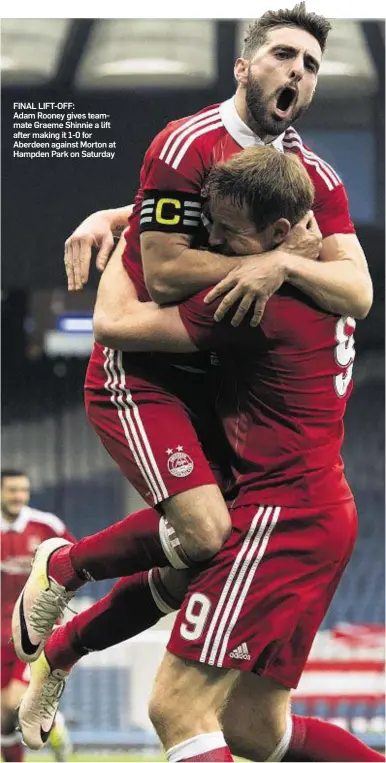  ??  ?? FINAL LIFT-OFF: Adam Rooney gives teammate Graeme Shinnie a lift after making it 1-0 for Aberdeen against Morton at Hampden Park on Saturday