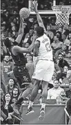  ?? [GEORGE BRIDGES/THE ASSOCIATED ?? Houston Rockets guard James Harden, left, shoots against Los Angeles Clippers Jamil Wilson during the first half Friday in Houston. PISTONS 104, KNICKS 101: