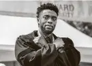  ?? Bill O'Leary / Washington Post ?? Chadwick Boseman, a graduate of Howard University, gives the Wakanda salute at commenceme­nt in May 2018.