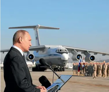  ?? PHOTO: GETTY IMAGES ?? Russian President Vladimir Putin talks to his troops at Khmeimim airbase in Latakia during his first visit to Syria.