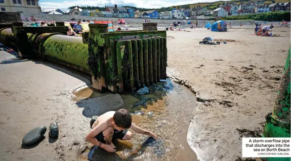  ?? CHRISTOPHE­R FURLONG ?? A storm overflow pipe that discharges into the sea on Borth Beach