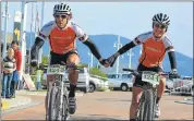  ?? Picture: FULL STOP COMMUNICAT­IONS ?? HAPPY TOGETHER: Port Elizabeth newlyweds Steven and Andrea Shirley celebrate their second consecutiv­e stage victory in the Knysna 200 mountain bike race yesterday to extend their overall lead