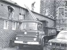  ??  ?? The rear of the Davidson Building fronting Bank Place with workers starting demolition works in 1976.