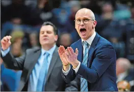  ?? STEPHEN DUNN/AP PHOTO ?? In this Feb. 23 file photo, UConn coach Dan Hurley cheers on his team during the second half of a game against South Florida at Gampel Pavilion in Storrs.