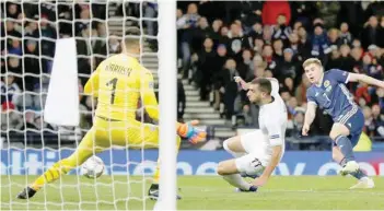  ?? — Reuters ?? Scotland’s James Forrest shoots at goal.