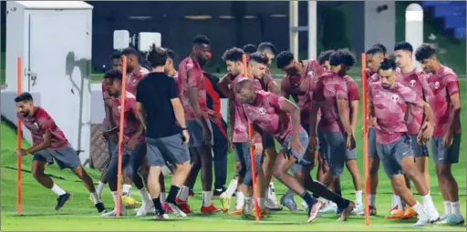  ?? (AFP) ?? Qatar’s players take part in a training session at the Aspire training site in Doha on Saturday on the eve of the FIFA World Cup Qatar 2022 opening against Ecuador.