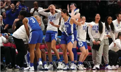  ?? Photograph: Icon Sportswire/Getty Images ?? The Duke bench reacts to a basket during their victory over Ohio State.