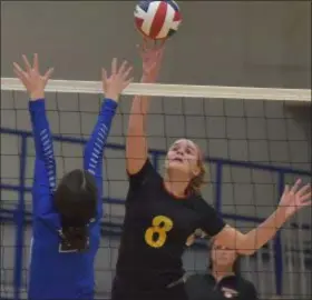  ?? PETE BANNAN – DIGITAL FIRST MEDIA ?? Penncrest’s Megan Arndt, right, tips a ball over the net as Great Valley’s Alana Cunningham defends Tuesday during a district volleyball game won by Great Valley.