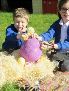  ?? Picture: Sue Corcoran ?? EGGY FUN: Joe Boakes, five, and his sister Ariane, nine, creating their Easter egg hunt display for their front garden. Their parents hope to drape a giant fried egg over the roof of their bungalow