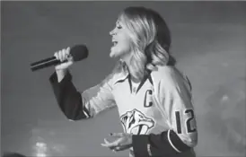  ?? MARK HUMPHREY, THE ASSOCIATED PRESS ?? Carrie Underwood sings the U.S. national anthem before a Nashville Predators playoff game.