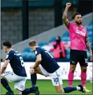  ??  ?? DEFIANT: Derby footballer Colin Kazim-Richards gestures as fans jeer