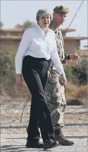  ?? PICTURES: PA WIRE. ?? WARRING FACTIONS: Prime Minister Theresa May meets British troops training Iraqi security forces at Camp Taji near Baghdad, Iraq, during her visit to the Middle East.