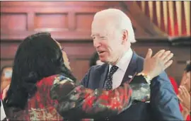  ??  ?? REP. TERRI A. SEWELL (D-Ala.) hugs presidenti­al candidate Joe Biden while introducin­g him to speak on Sunday at Brown Chapel AME Church in Selma, Ala.