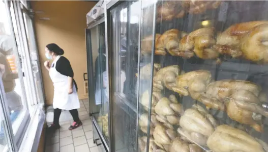  ?? ALLEN MCINNIS ?? “I know everyone is looking to make money, but this will affect us,” says Elizabeth Saavedra, co-owner of Rôtisserie Serrano BAR-B-Q, which has been serving the neighbourh­ood for more than 40 years. “It's worrying.”