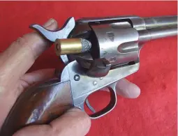  ??  ?? BELOW: It felt odd slipping the short cartridges into a Colt Peacemaker.