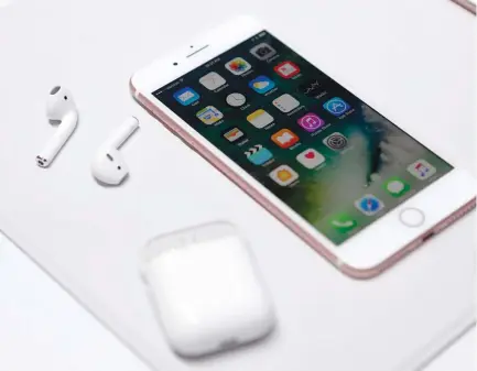  ?? (Beck Diefenbach/Reuters) ?? THE APPLE iPhone 7 and AirPods are displayed during an Apple media event in San Francisco last week.
