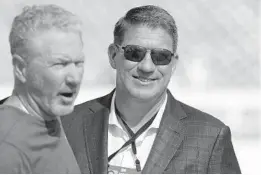  ?? CHRIS O’MEARA/AP ?? Coach Dirk Koetter, left, and general manager Jason Licht face uncertain futures with the Buccaneers assured of a losing season.