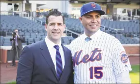  ?? Seth Wenig / Associated Press ?? Mets new manager, Carlos Beltran, right, poses for a picture with general manager Brodie Van Wagenen after a news conference at Citi Field on Nov. 4 in New York.