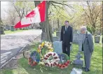  ?? CP PHOTO ?? Reverend Harold Steven, right, and his son, Andrew Steven, stand at the grave of their relative, Ian Hector Steven, a Scottish soldier who died in Canada after the First World War, following a ceremony to consecrate the new headstone, in Toronto’s St....