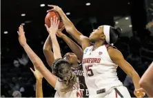  ?? Nam Y. Huh / Associated Press ?? Stanford’s Maya Dodson blocks a shot by Missouri State’s Brice Calip, one of six blocks by the Cardinal in the game.